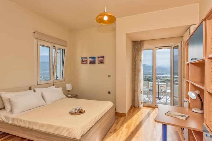 Third bedroom with queen size bed. There is a balcony with view to sea, mountains and city of Chania. Bedroom with aircondition.