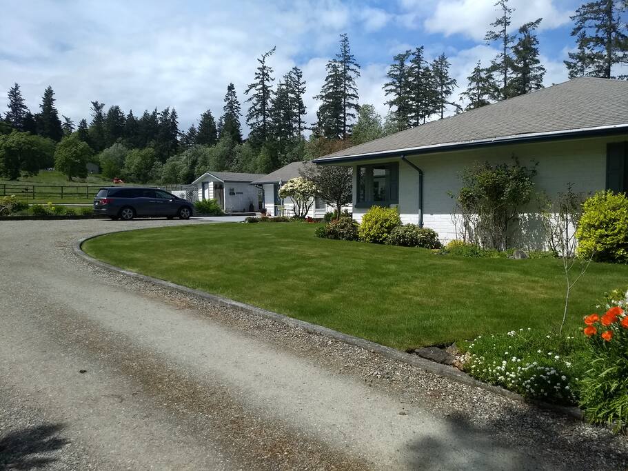 Drive and park in back of house. Entry door is on the left.