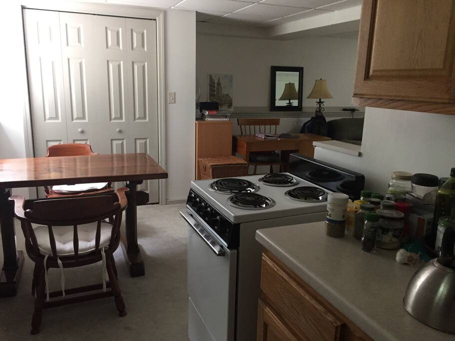 Galley kitchen and dining area