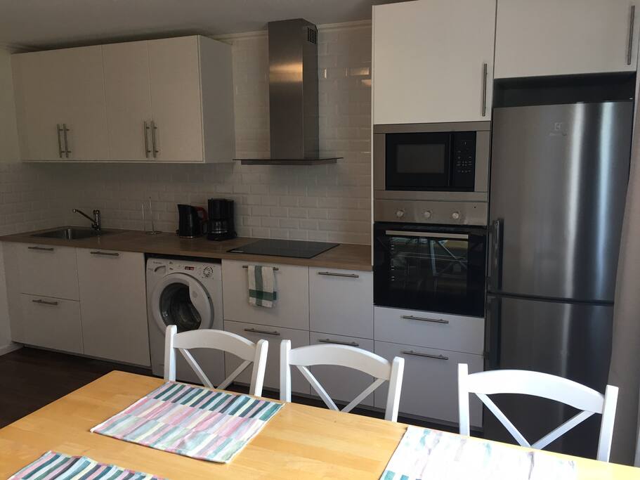 kitchen including washing machine and dish washer