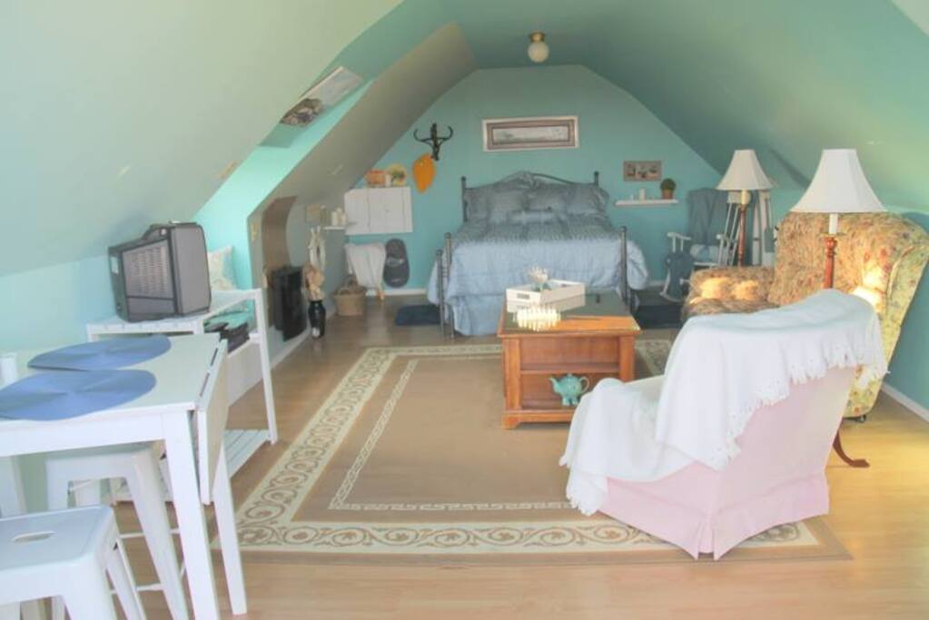 Sitting area - eating area - small kitchen/fridge set up for coffee/tea - hot/cold water tank - no running water - antique wash stand for washing - no shower