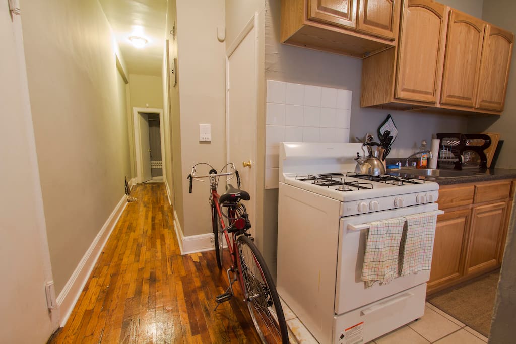 The open floor plan of this apartment provides a social setting between the kitchen and living room. The long hallway leads to the bedroom and bathroom in the back of the apartment, which also provides a quiet place to sleep!