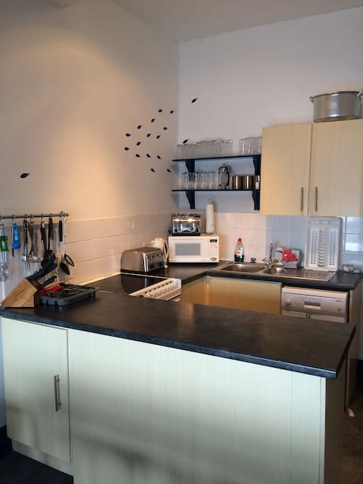 Fully equipped kitchen. Cooker, kettle, microwave, toaster, dishwasher and fridge.