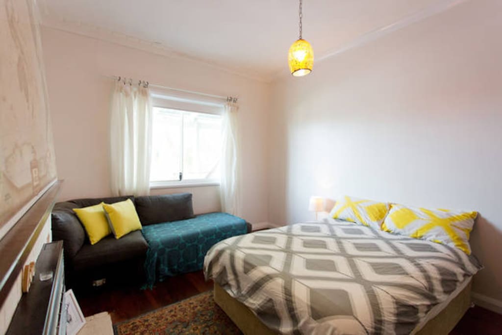 Double bed and sofa in the room