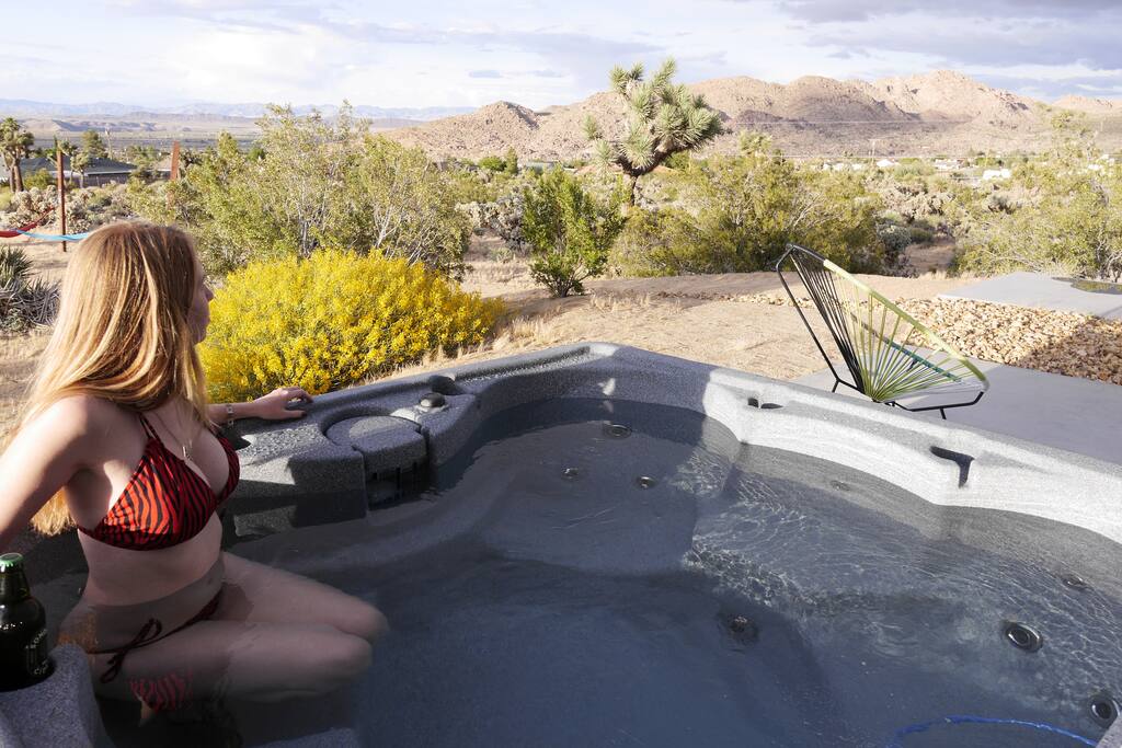 Relax and soak in the panoramic view from the Spirit Wind hot tub. It seats 6. It's the perfect way to unwind after a long hike in the park.