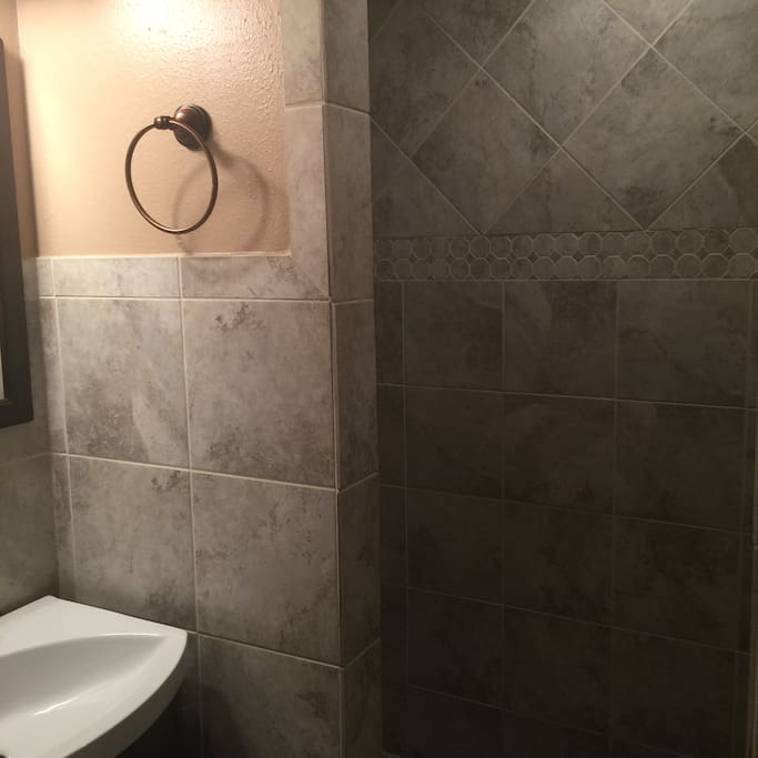 Shower in bathroom connected to guest bedroom #1