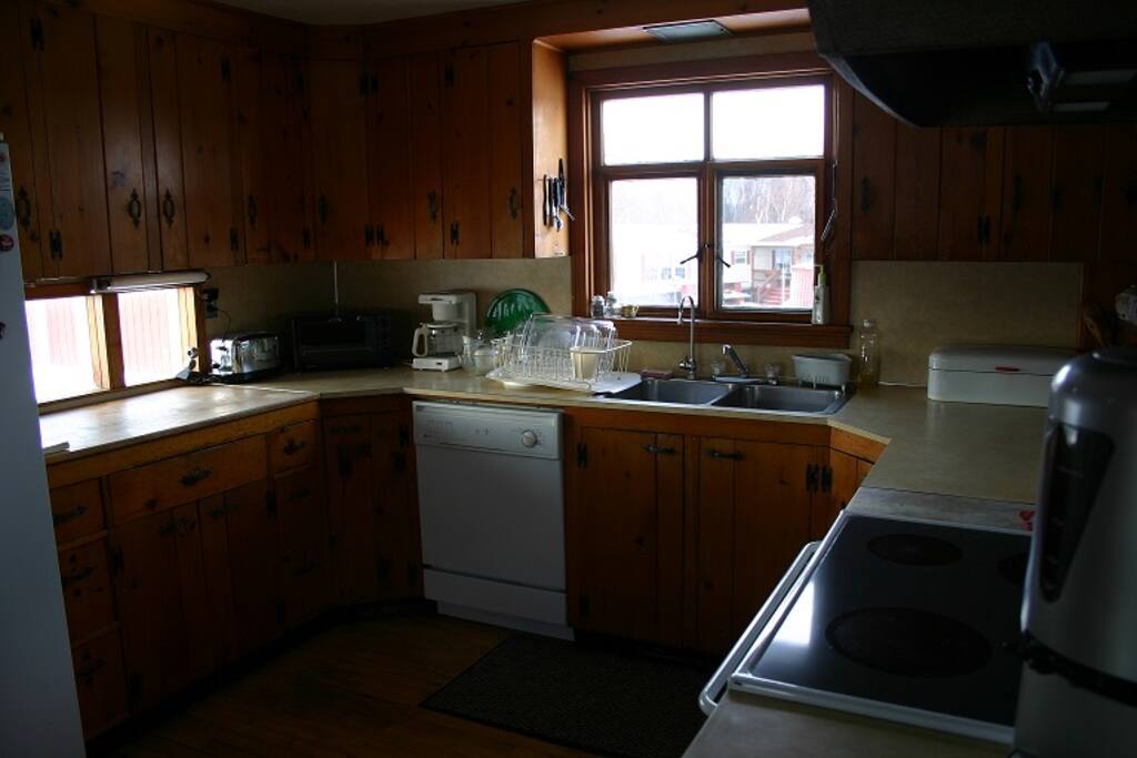 Kitchen w/dishwasher,fridge,glass top stove and eat at counter