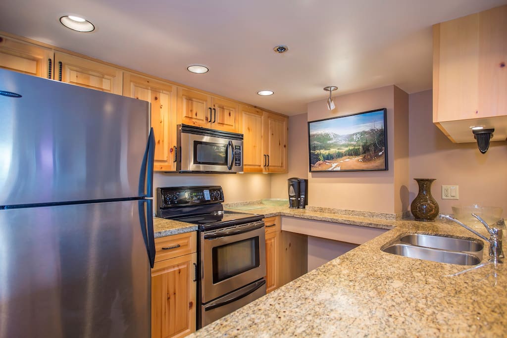The kitchen is fully-equipped, features granite countertops, and has an open-layout so you can still chat with company in the living room.