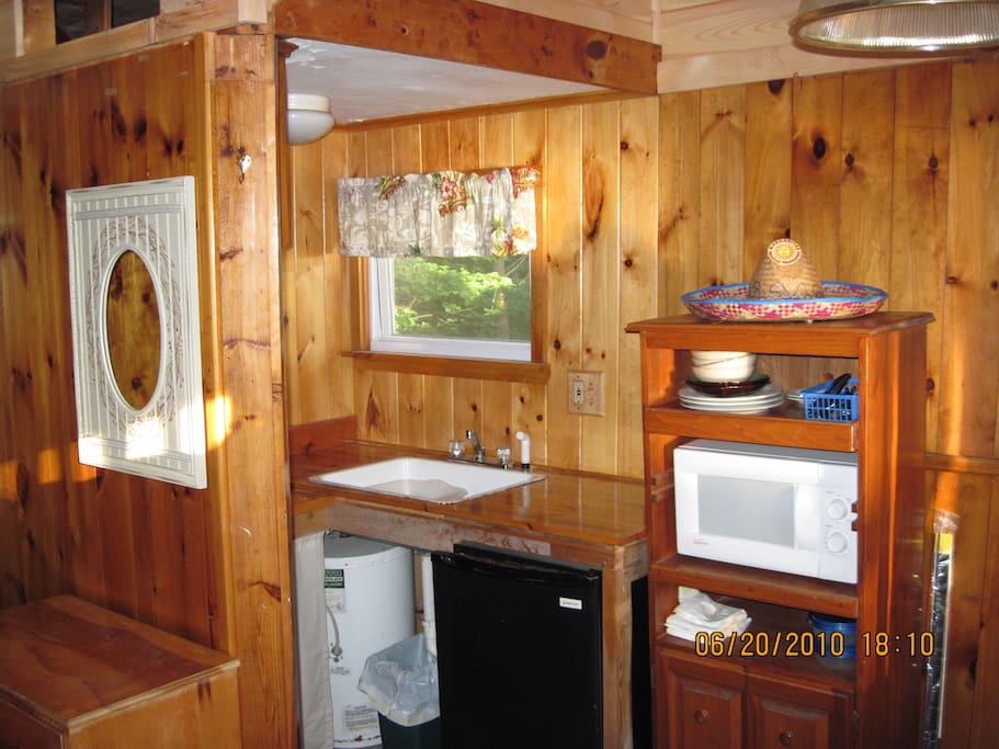 Kitchen area with 2 burner cooktop, Small refrigerator, Microwave toaster & coffee maker