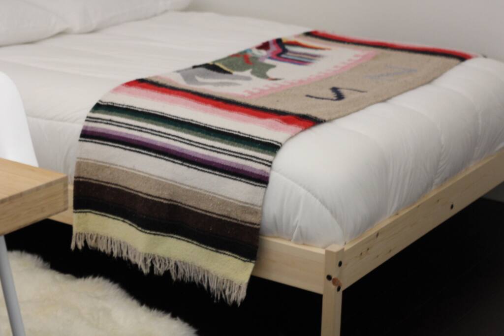 Charming and cozy 2nd Bedroom with a sheepskin rug for those cold nights.