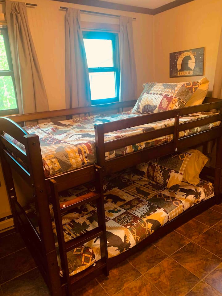 This room is located downstairs directly off the kitchen. The bathroom and laundry room are in the room as well.