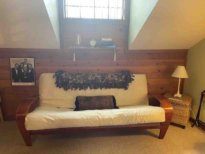 Queen futon in upstairs bedroom~ all linens can be found in basket to the right of futon