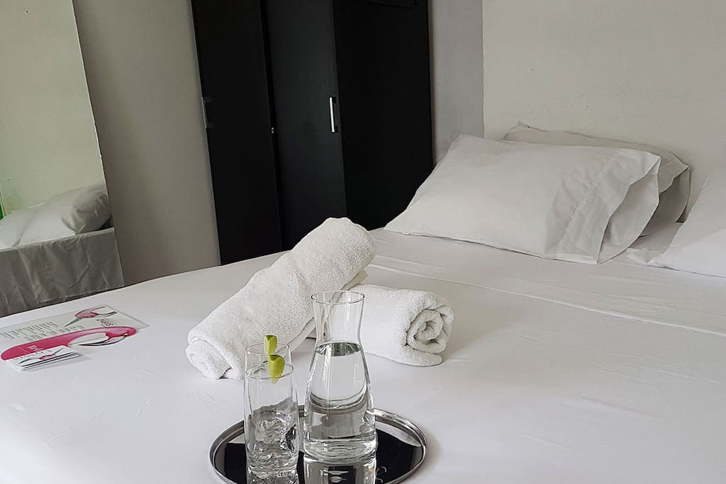 View of the bed and wardrobe