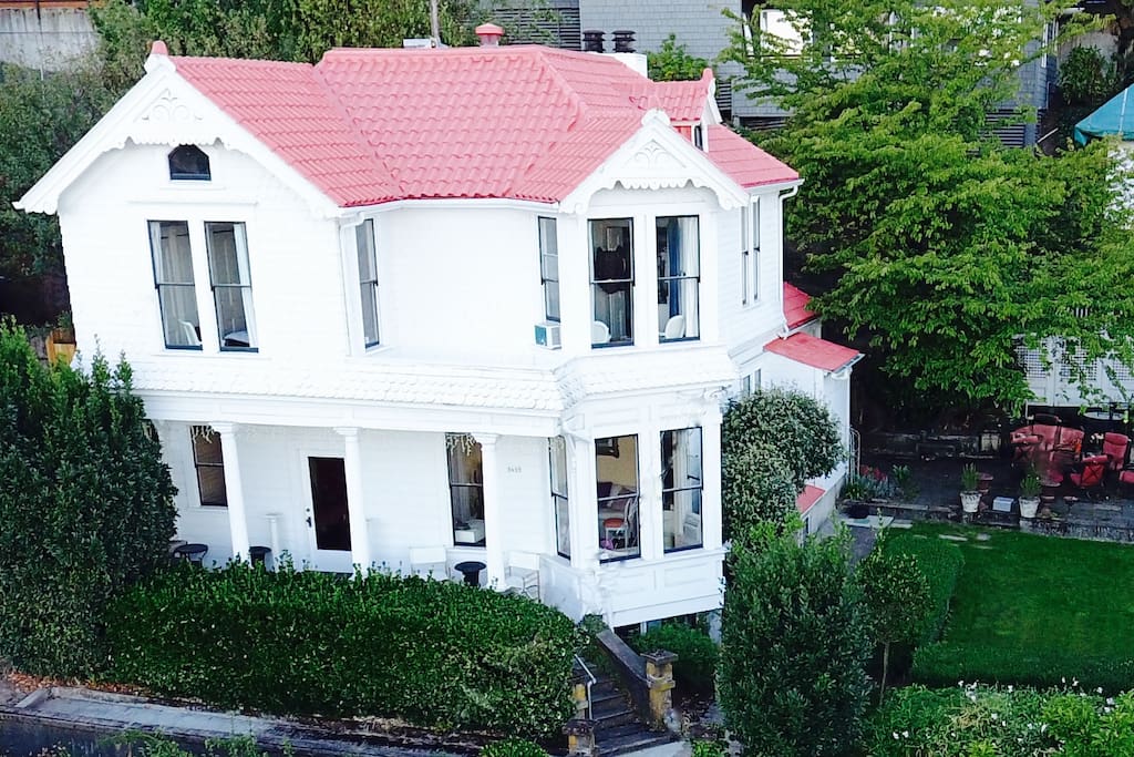 A drone's eye view of the house, side yard, patio and out buildings