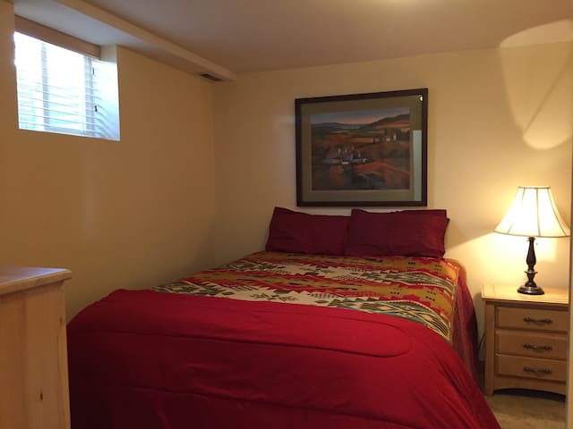 Spare bedroom in cozy home for mountain explorers