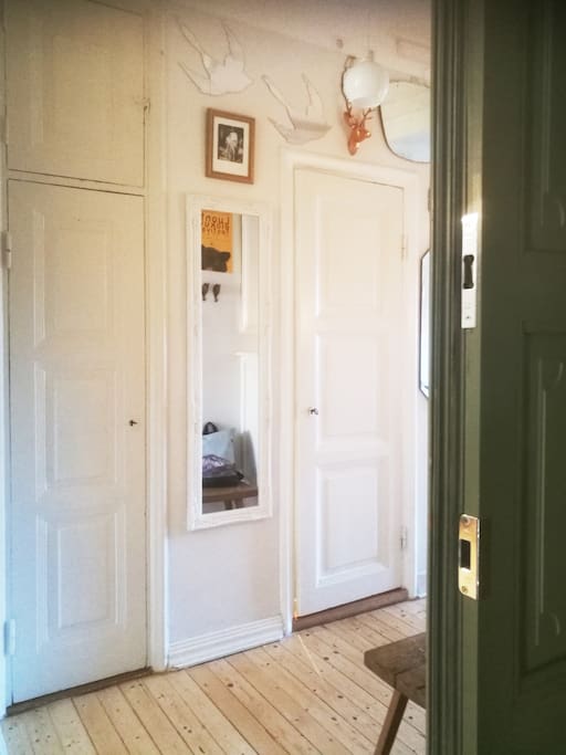 This is the view when you enter the flat. The front door is old and green and hallway filled with mirrors and art. It welcomes you with the old feel and peacefullness.