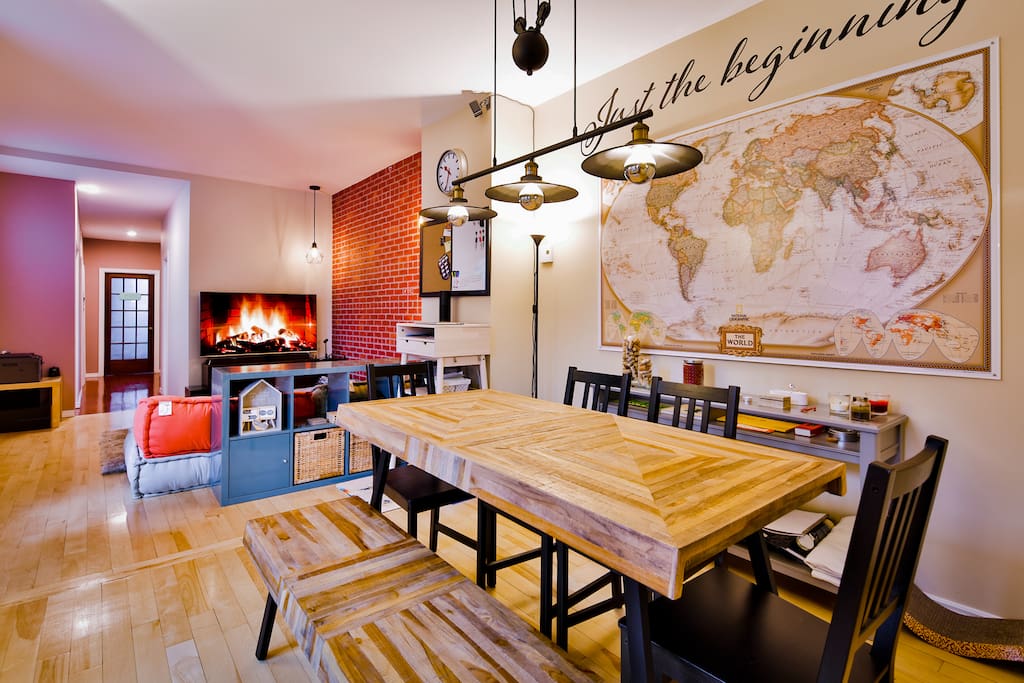 Our communal living room and dining area with world map & 55" 4K HDTV