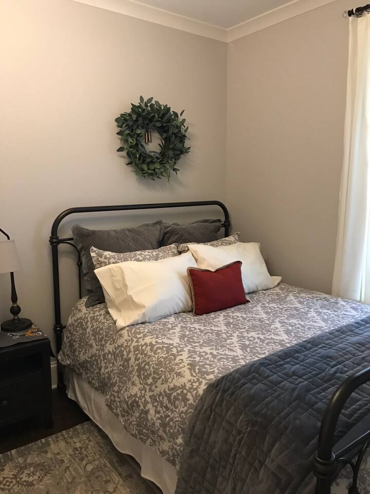 Queen bed with Beautyrest mattress, organic cotton sheets, linen duvet cover. There is also a wall mounted TV in this room, a ceiling fan, and ample closet space.