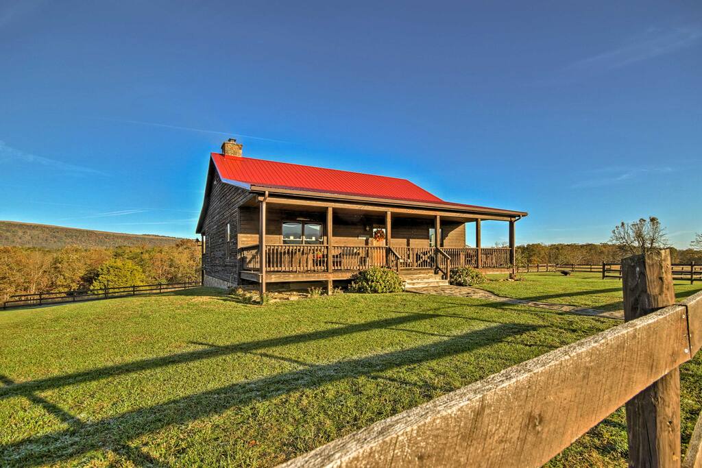 This home is nestled on 110 private acres, surrounded by scenic woods and sprawling meadows with fruit trees.