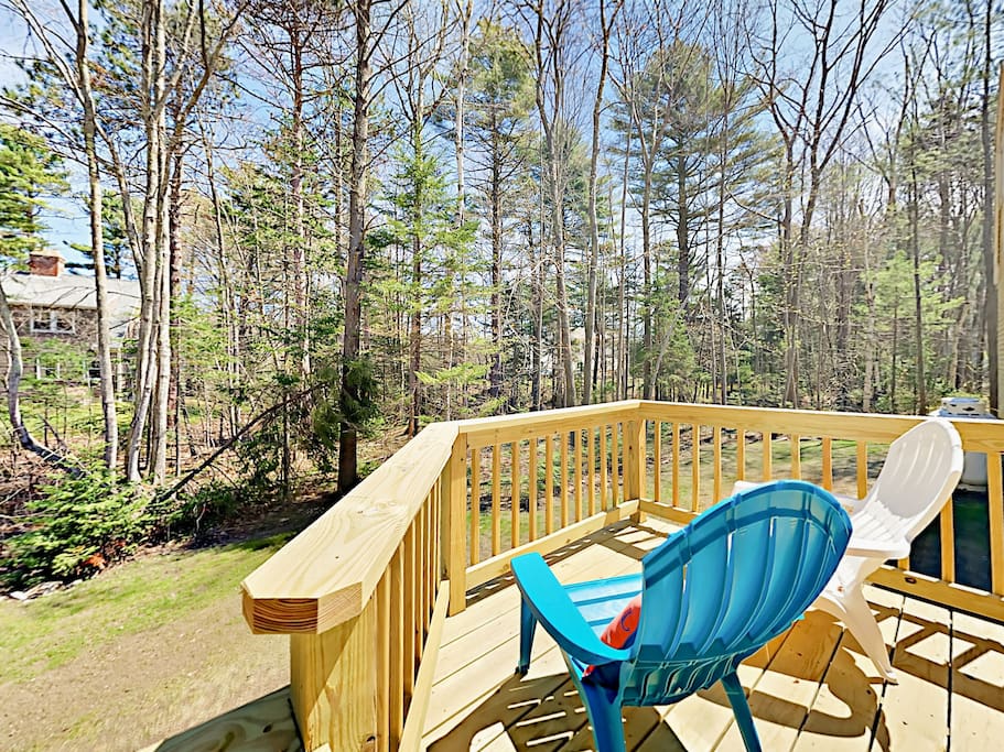 Grab a crisp beverage and unwind on the deck overlooking the property.
