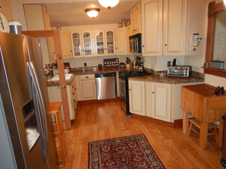 Kitchen with gas stove, dishwasher, microwave, refrigerator