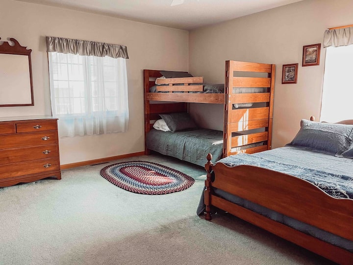 The bedroom on the main floor provides guests with twin bunkbeds and a full bed! It also has a tv with DVD player to watch movies. 