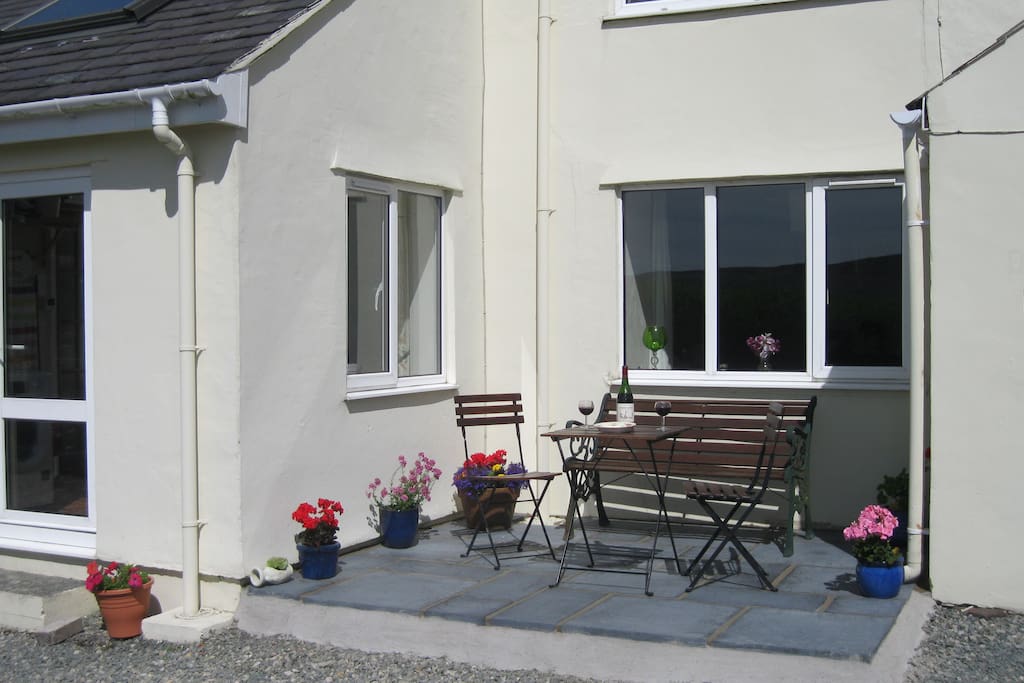 cottage front: Patio area to catch afternoon and evening sun