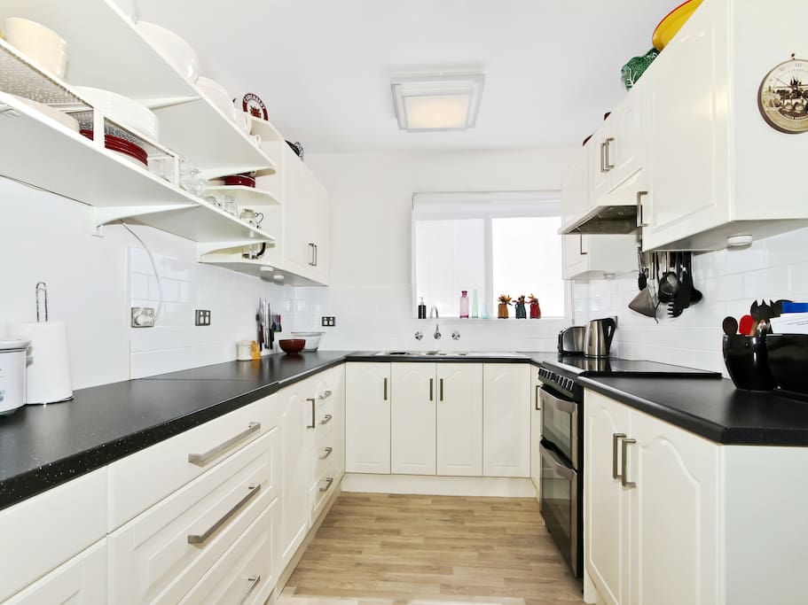 The newly renovated kitchen has an induction cooktop, microwave, slow cooker, large fridge, quality cookware, crockery, and glassware. You'll find tea and coffee supplies and a range of oils, sauces, herbs and spices.