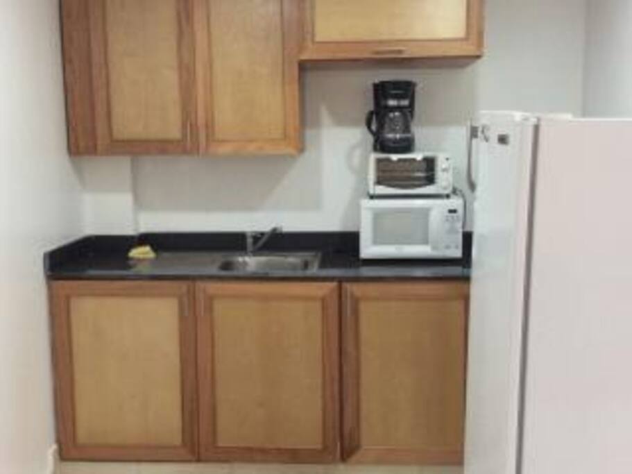 Fitted kitchen with microwave stove and every amenity for cooking