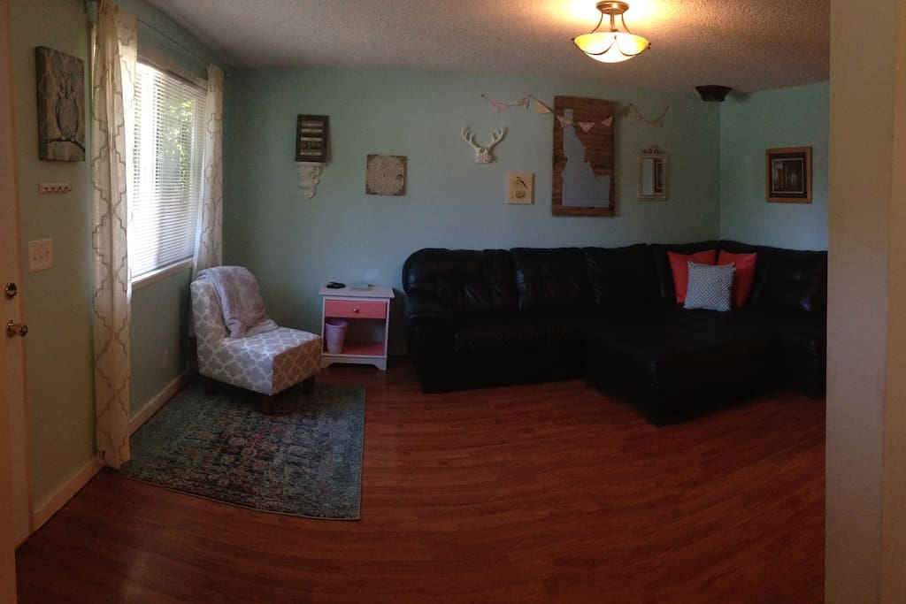 The living room is calm and inviting, with plenty of comfortable seating.