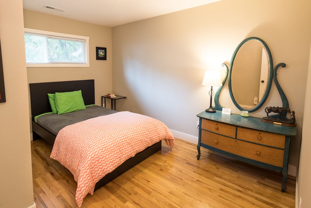 Private bedroom with closet and hangers