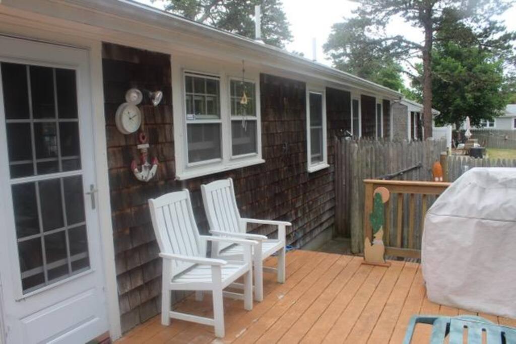 Relax on deck overseeing large yard