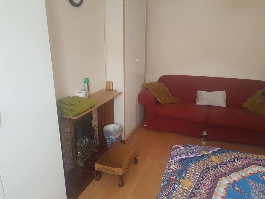 A fire place and sofa for added comfort.