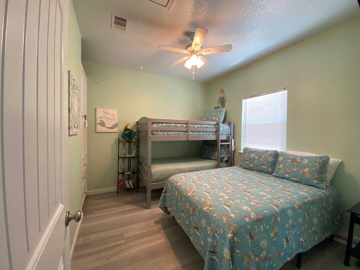 second bedroom with full bed and twin bunk beds