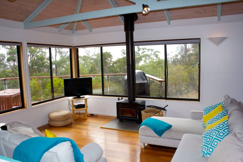 Open plan living area with pot belly fire