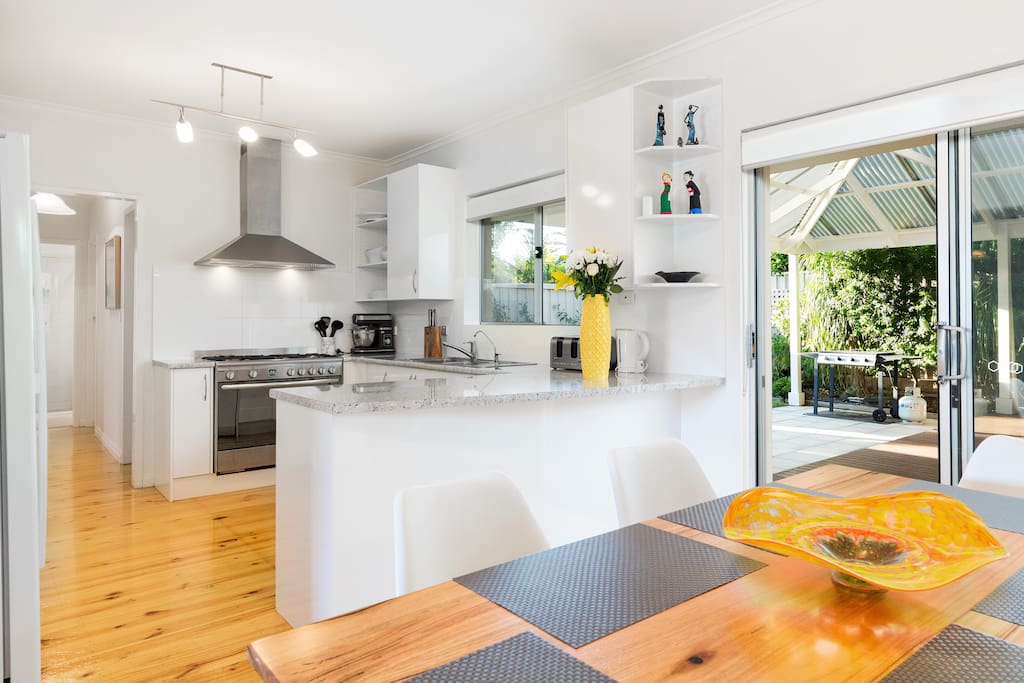 KITCHEN DINING ROOM WITH ACCESS TO THE BACK DECK
