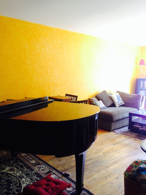 Notice our lovely piano and goldenrod living room!