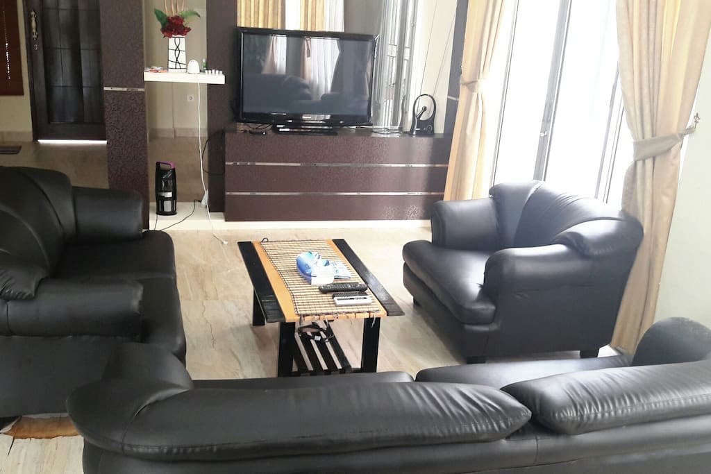 living room with TV and Sofa set.