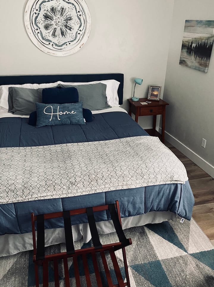 Beautiful and Roomy describes this fantastic bedroom, complete with;  a giant king size bed, clean cozy bedding, an oversized dresser, desk and double closets. Everything you need for a great stay. 