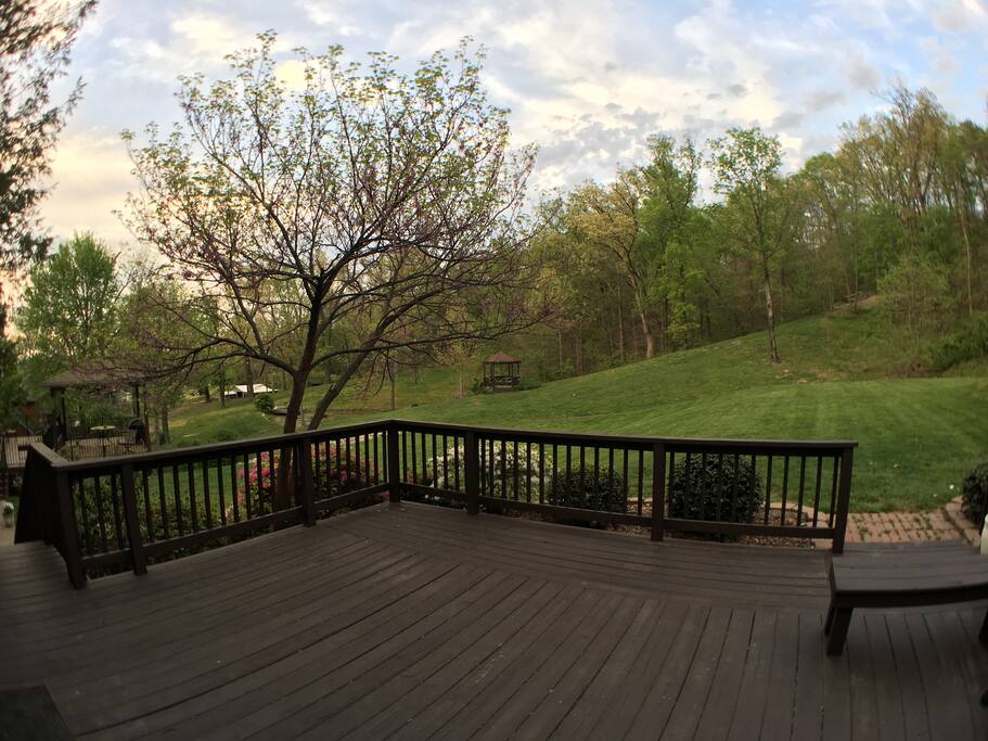deck overlooking wooded property