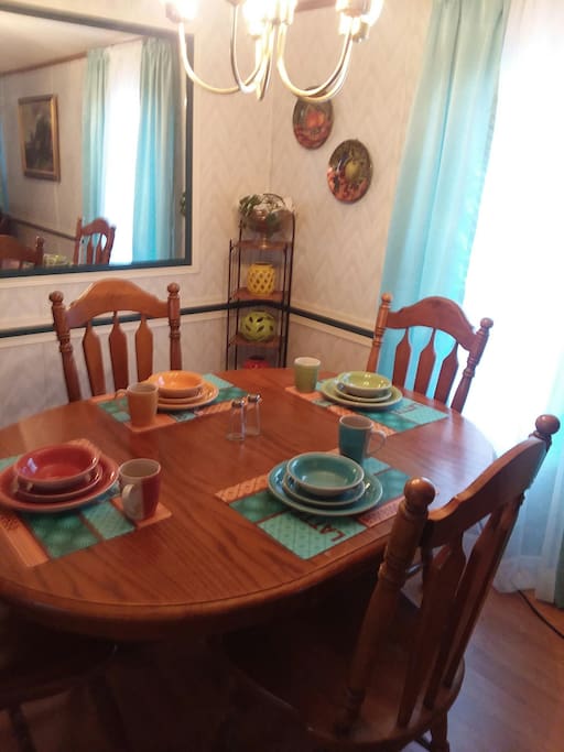 Place setting for four glassware , flatware provided