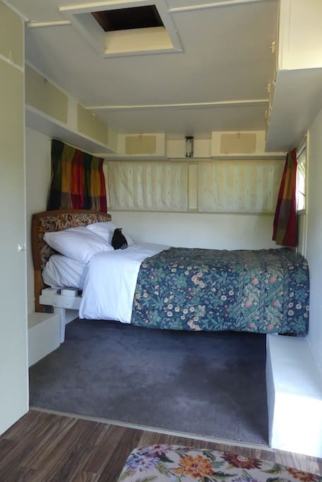 Comfy double bed in newly restored caravan.