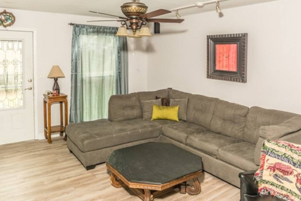 Large living room sectional complete with sofa sleeper