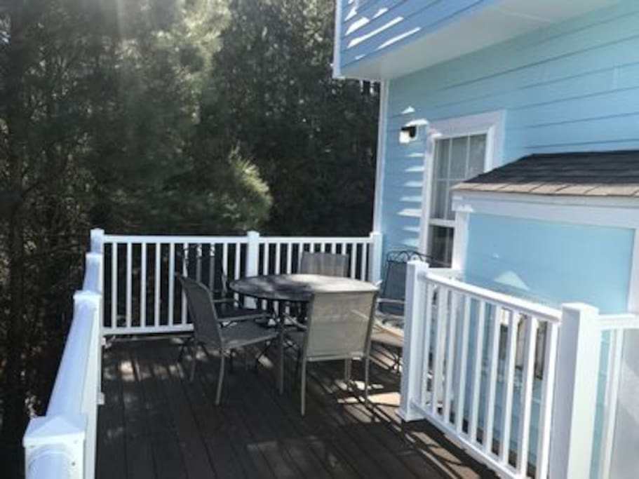Private deck off living room fully enclosed by trees-perfect for enjoying crabs and drinks!