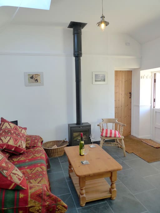 Light open living room with cosy working woodburning stove