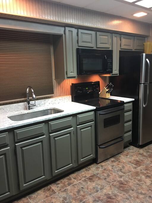 Kitchen (stove, full size refrigerator, microwave)