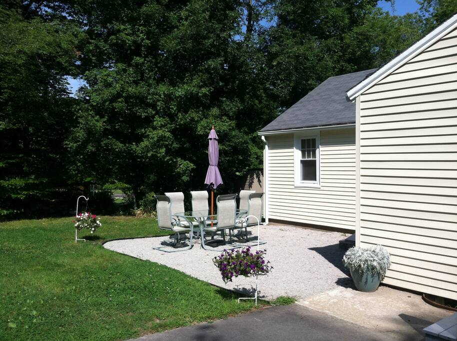 Relax on the patio with comfy patio set and charcoal grill!