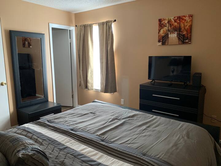 2nd suite has queen bed, dresser, night stand and 32 inch TV. Has private bathroom and walk-in closet with extra foldout bed.