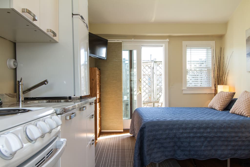 As you enter the condo the gorgeous kitchen, hardwood floors, and modern decor welcome you.