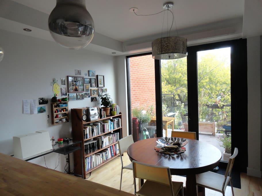 Dining/working table in open area. Again, huge windows, and access to back patio.